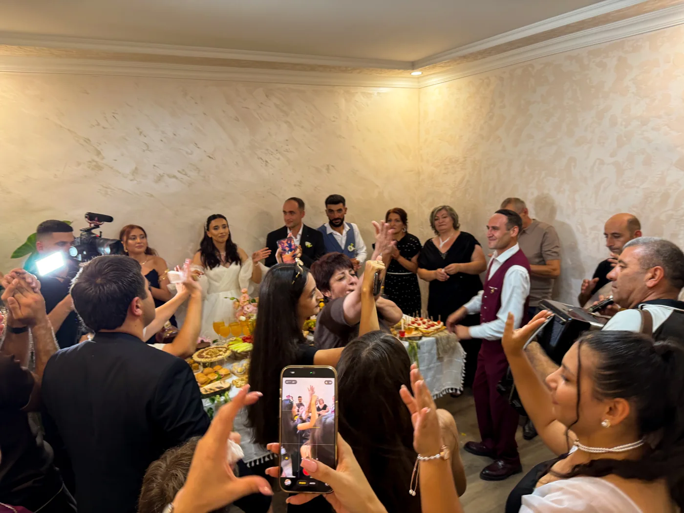 Family and friends celebrating an Armenian wedding with music and dancing